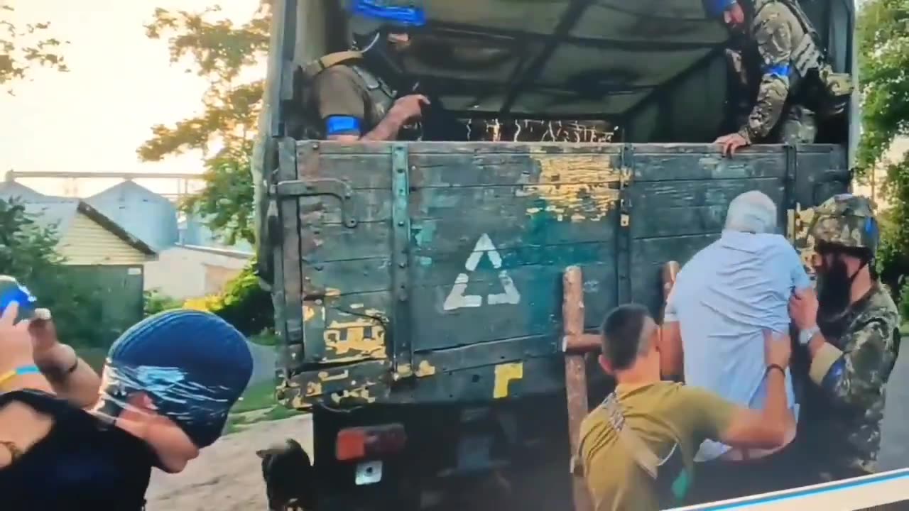 Here we see the Ukranian forces grabbing some people and forcing them into a truck