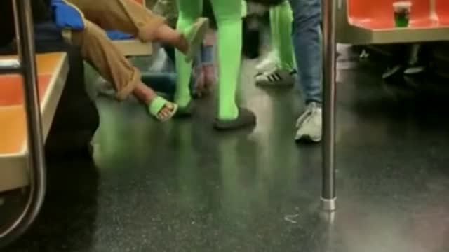 Women In Neon Green Body Suits ATTACK NYC Subway Passengers