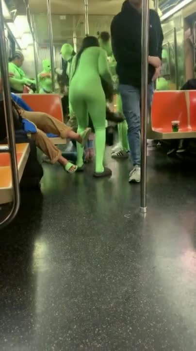 Women In Neon Green Body Suits ATTACK NYC Subway Passengers