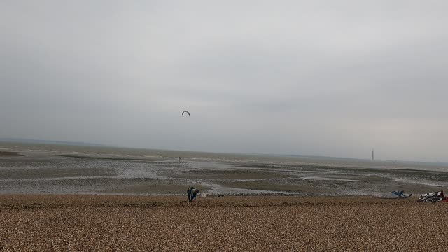 Kite surfer prepping to go out to the sea to kite surf