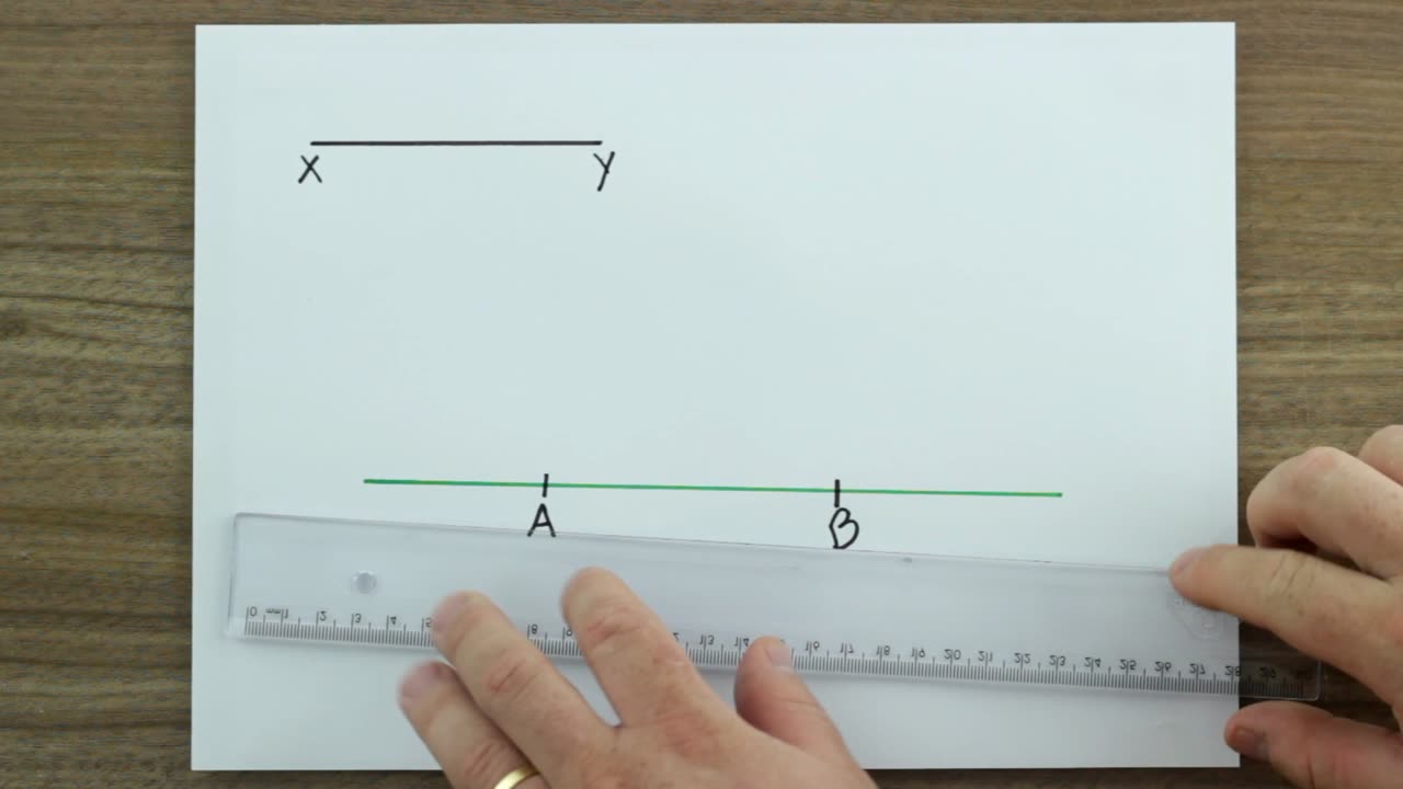 Construir um segmento de reta AB de medida igual à medida de outro segmento de reta XY dado.