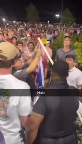 Police Officer Decides To Cut Down A Student's Pro-Trump Flag At The Arkansas-Mississippi Game