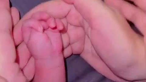 Sleeping baby shows middle finger