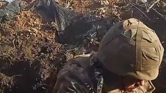 Ukrainian firing a PKM 7.62mm machine gun in Bakhmut.