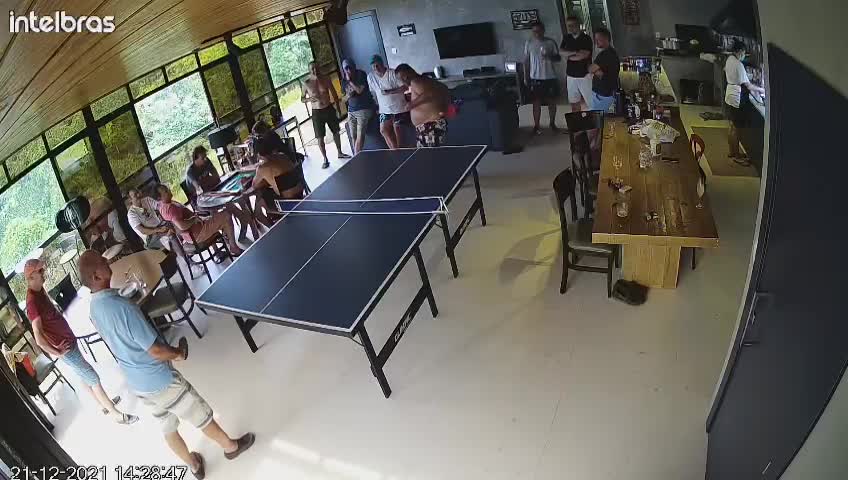 Guy Playing Ping Pong Takes a Dive on the Table