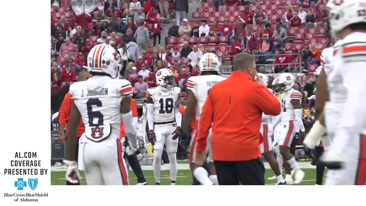 Cadillac Williams takes the field for warmups ahead of the Iron Bowl; shakes hands with Nick Saban