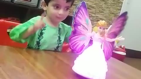 Girl playing with doll in her room