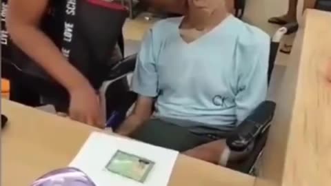 WOMAN BRINGS DEAD MAN INTO BANK TO SIGN A LOAN