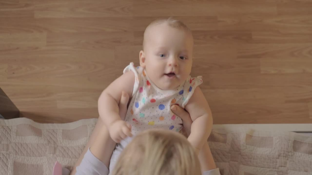 Mother making her baby laugh