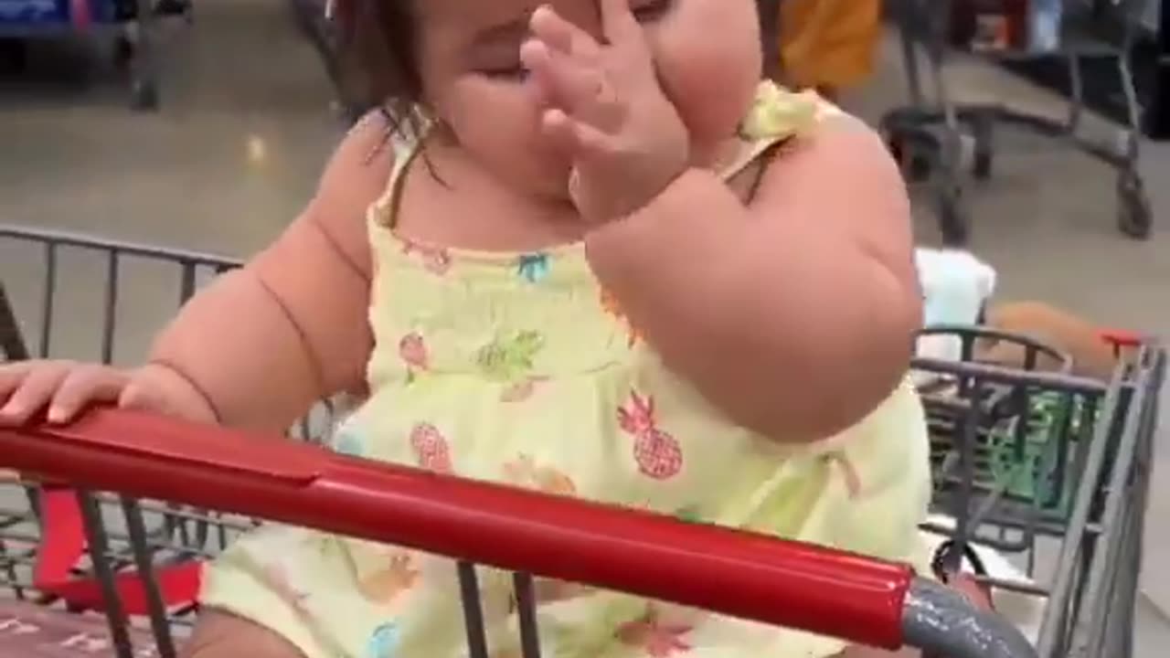 sleeping baby in market shopping