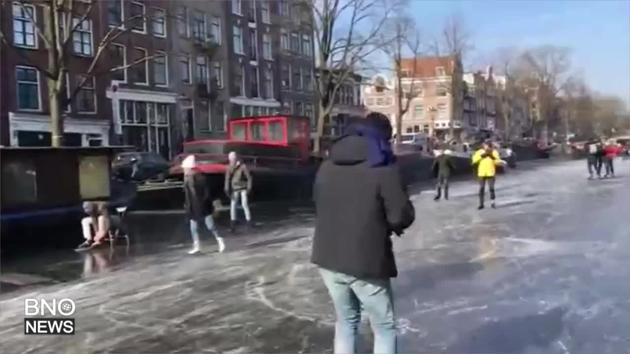 Ice skaters grace over frozen canals during Netherlands cold snap