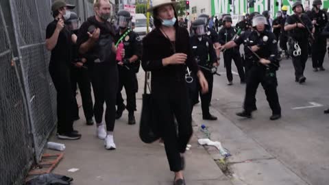 Hollywood Protesters Pushed Against Fence During Protest