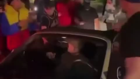 Look at how the african and muslim migrants behave to a womans car.