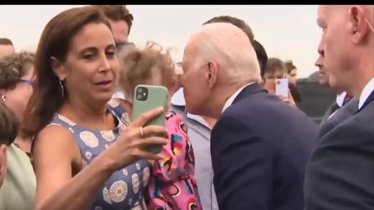 Biden nibbles kid