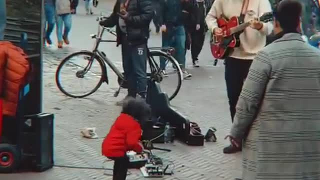 Cute Little Girl dancing with Street Performer