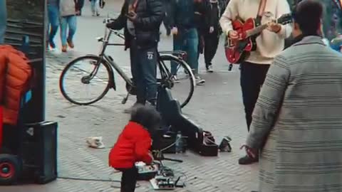 Cute Little Girl dancing with Street Performer