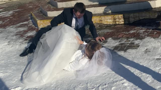 Slippery Steps Send Bride and Groom to the Ground