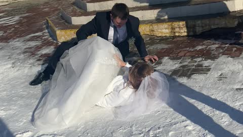 Slippery Steps Send Bride and Groom to the Ground