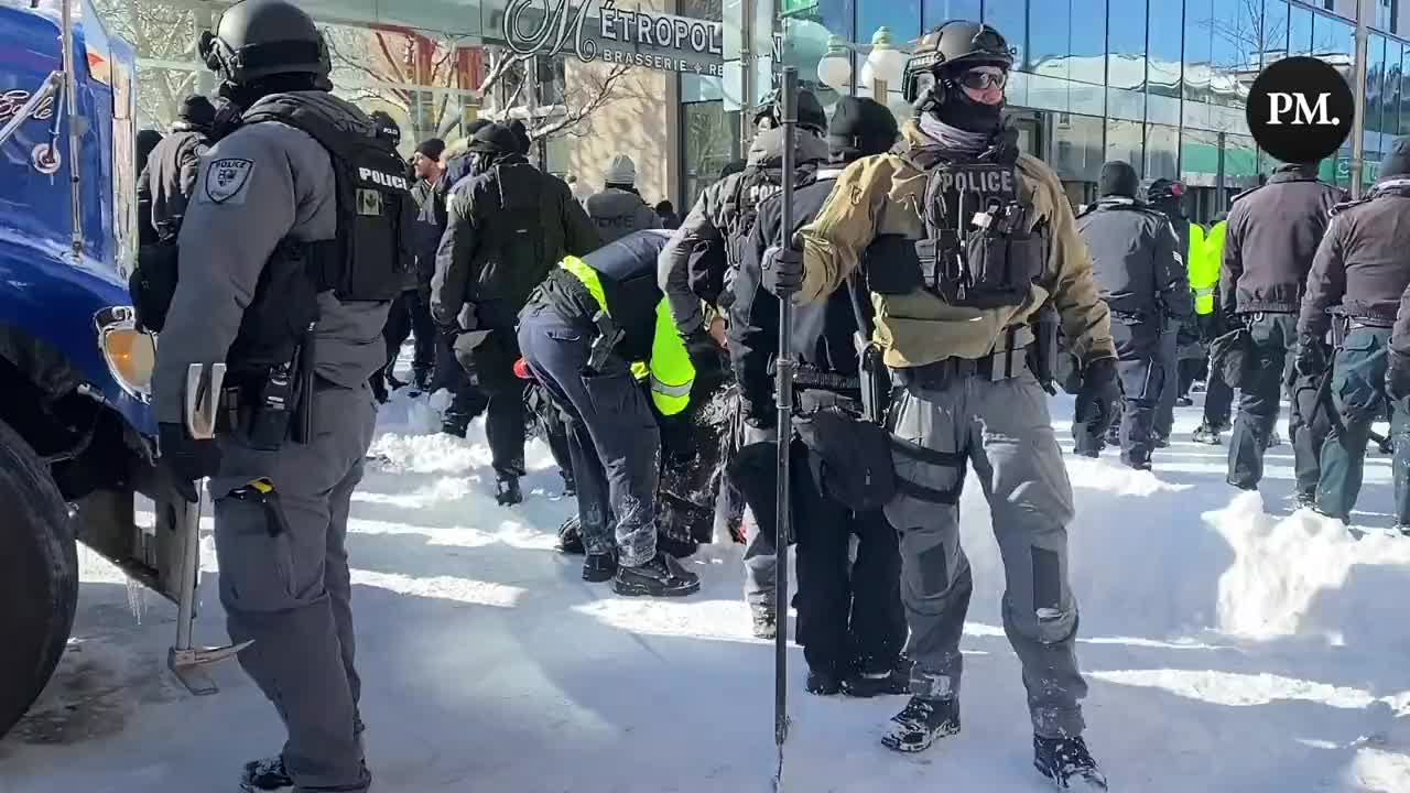 Police make an arrest as they continue to force freedom protestors out of the area