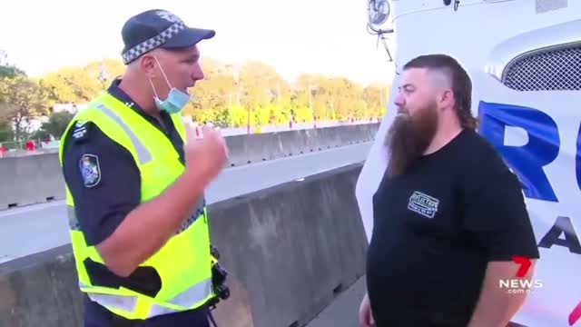 Aussie Truck Drivers grind highway to halt in protest of Vaccine mandates.