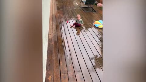 baby having fun with cats and dogs