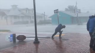 Jim Cantore gets hit by a flying tree branch during hurricane report