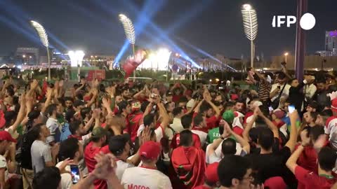 Moroccan football fans party in Doha _ AFP