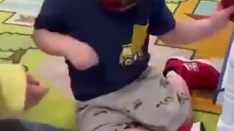 Toddlers forced to wear face mask