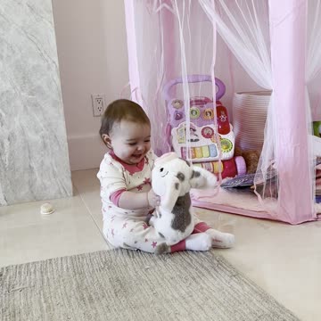 Baby Adorable Hugs Her Stuffed Animal