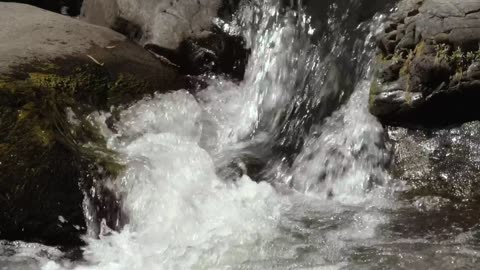 Water crashes among rocks