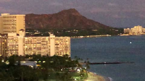 Glow in the dark paddle boarding Waikiki Beach