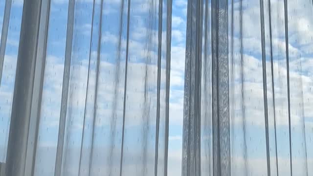 Lying on a hotel bed and looking at the sky and clouds