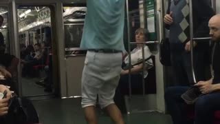 Man blue shirt white shorts dancing around