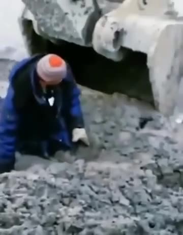 Man stuck in mud is being rescued