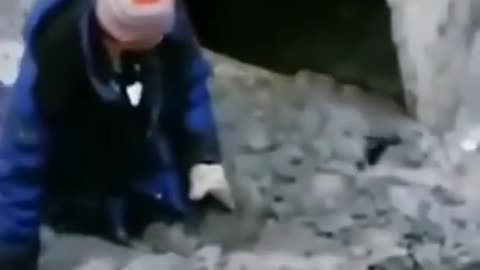 Man stuck in mud is being rescued