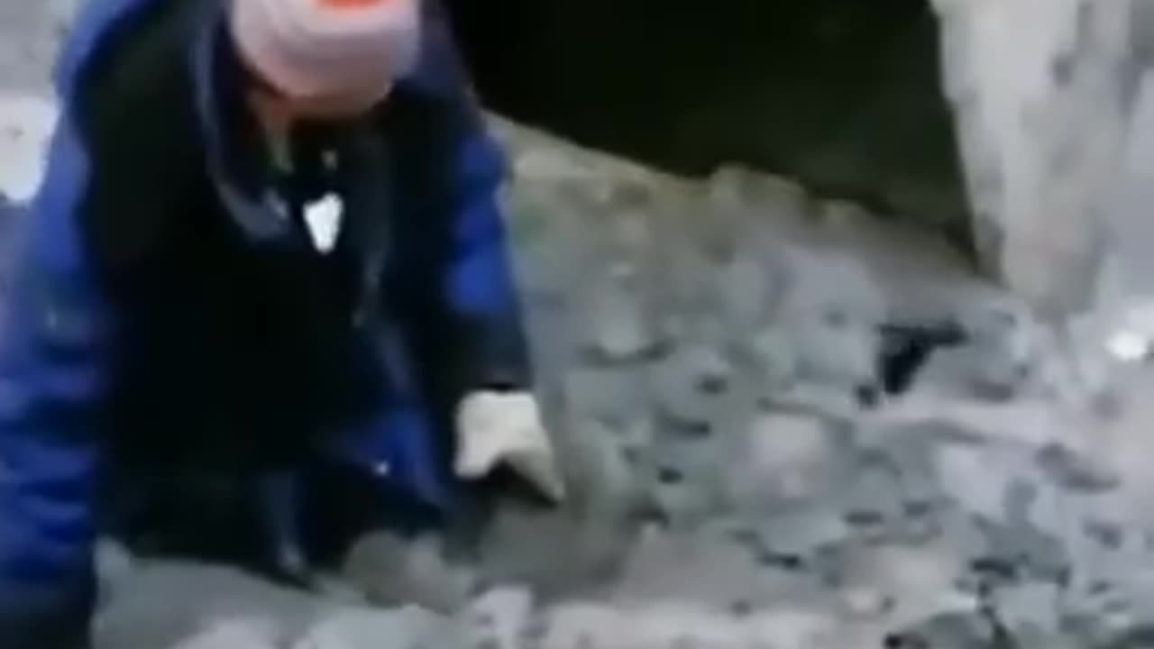 Man stuck in mud is being rescued