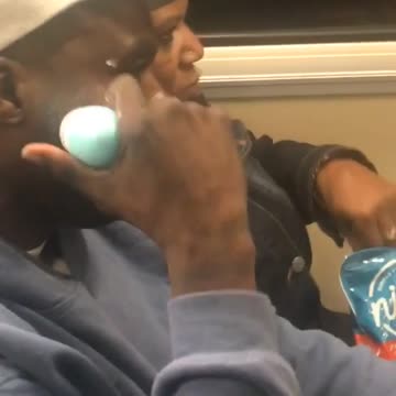 Man puts lotion on train