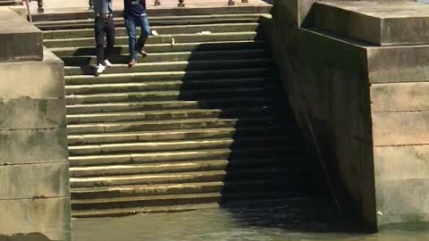 Guy Experiences A Solid Fall Down Some Slippery Steps On The Thames River