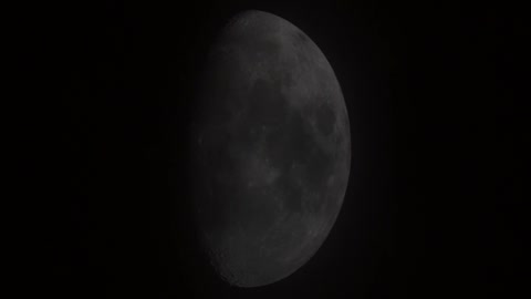 waxing gibbous moon thru clouds Mah02970