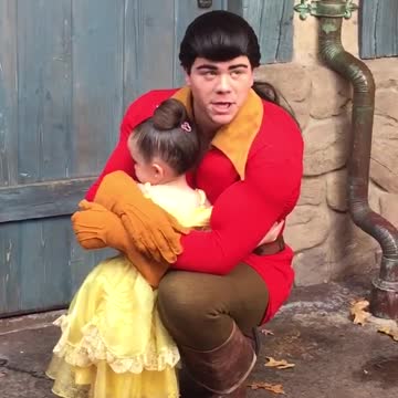 Little Girl Hugs Gaston At A Disney Park And Won't Let Go