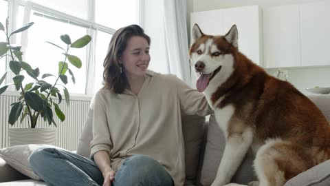 Woman Petting a Dogbeautiful