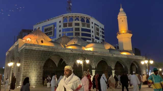 People Walking Outside a Mosque