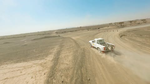 Off-Road Car Driving Along Dirt Road