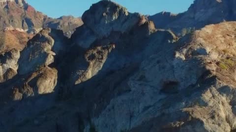 Aerial shot of a sunny mountain range