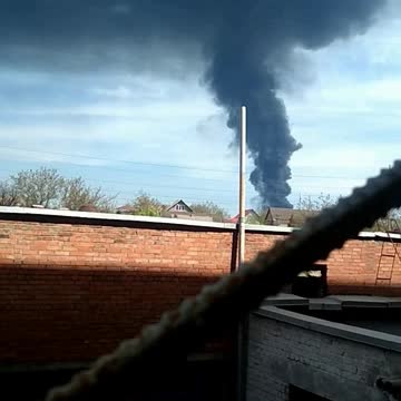 Ukraine War - A DPR fighter filming a burning oil depot near Donetsk