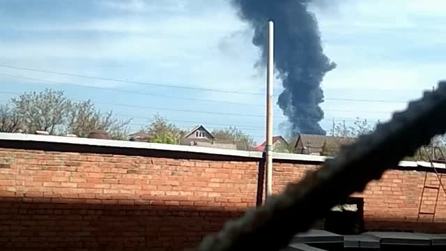 Ukraine War - A DPR fighter filming a burning oil depot near Donetsk