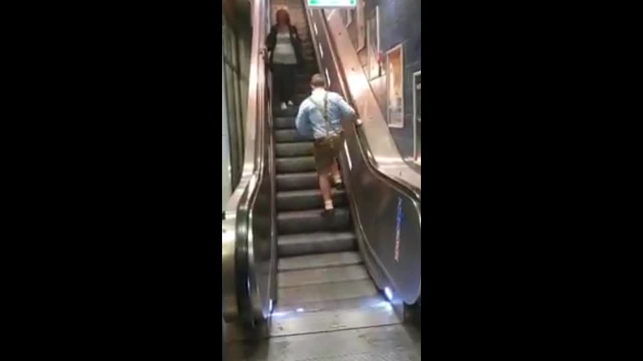 Drunk Oktoberfest Goers Struggle With Escalator