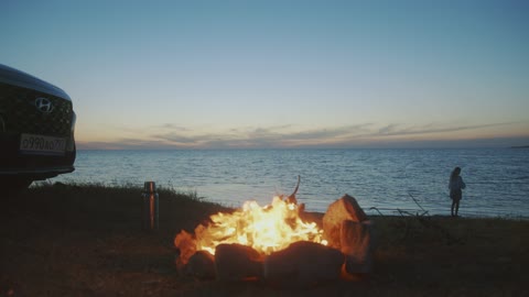 Wood fire next to a river