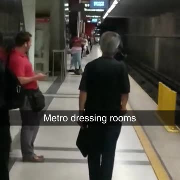 Metro dressing rooms a woman changes in subway station