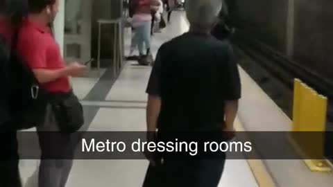 Metro dressing rooms a woman changes in subway station